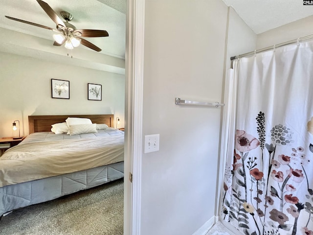 bedroom with carpet flooring, a textured ceiling, and ceiling fan