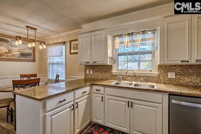 kitchen featuring stainless steel dishwasher, white cabinetry, kitchen peninsula, and sink