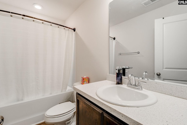 full bathroom with vanity, toilet, and shower / bath combo