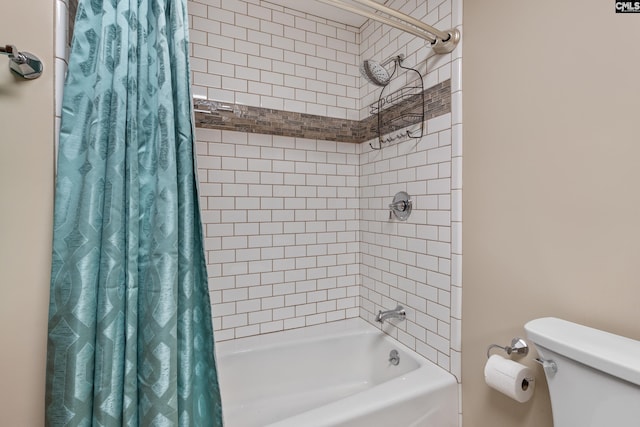 bathroom with shower / bath combination with curtain and toilet