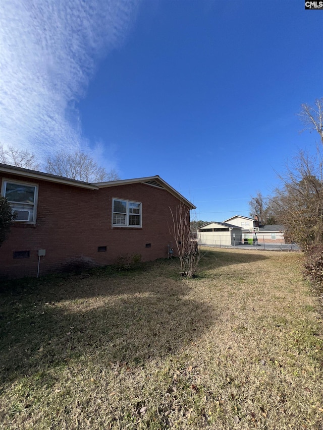 view of property exterior with a yard