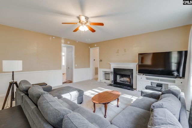 living room with light carpet and ceiling fan