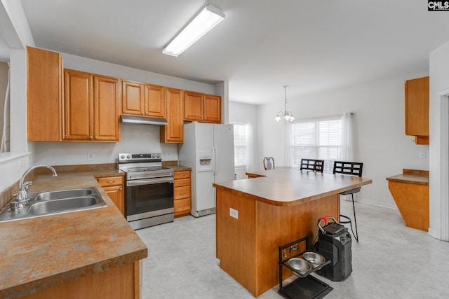 kitchen with sink, hanging light fixtures, electric range, white fridge with ice dispenser, and a kitchen island