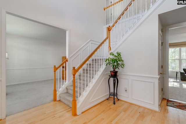 stairs featuring wood-type flooring