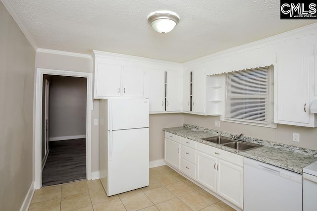 kitchen featuring white cabinets, white appliances, sink, and light tile patterned floors