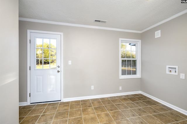 interior space with ornamental molding and a textured ceiling