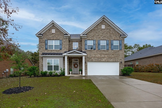 view of front facade with a front yard and a garage