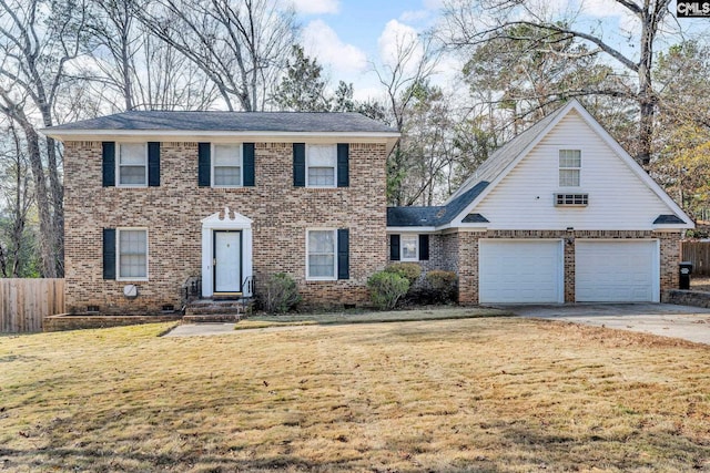 view of front of home with a front yard and a garage