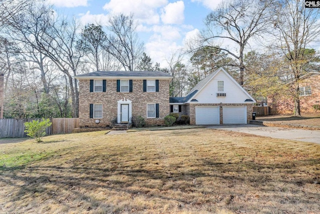 view of front facade with a garage and a front yard