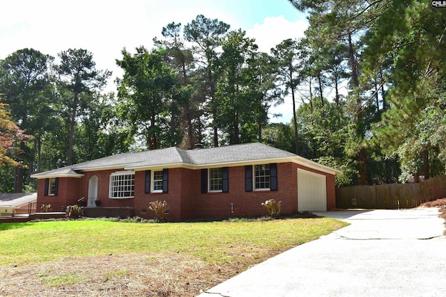 view of front facade with a front yard and a garage