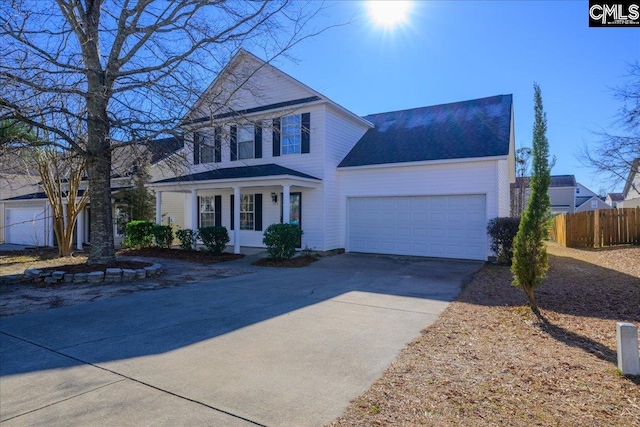 view of front of house featuring a porch and a garage