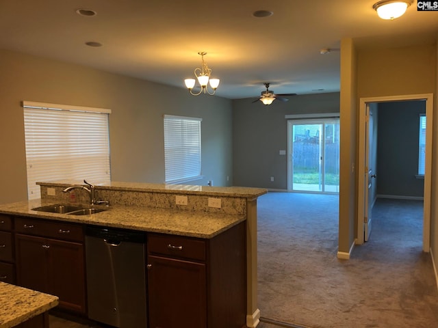 kitchen featuring dark carpet, stainless steel dishwasher, dark brown cabinets, sink, and decorative light fixtures