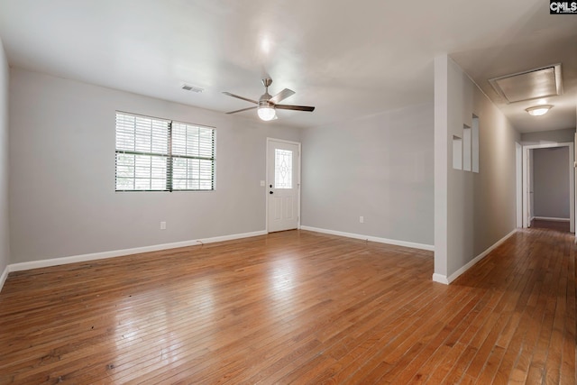 unfurnished room with ceiling fan and light wood-type flooring