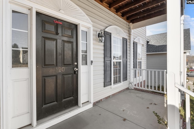 property entrance featuring covered porch