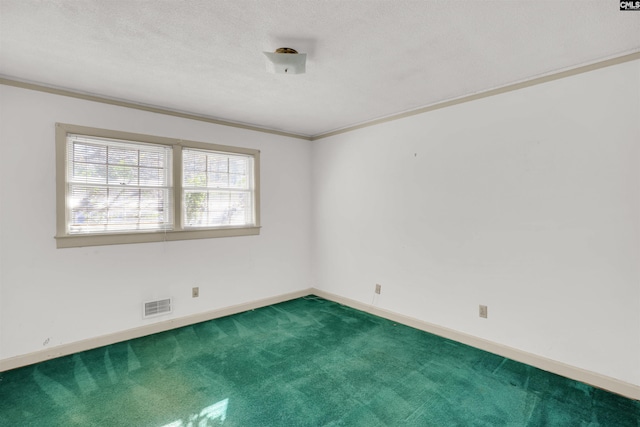 carpeted empty room featuring crown molding