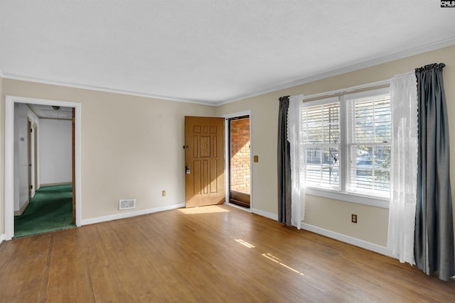 unfurnished room with wood-type flooring and crown molding