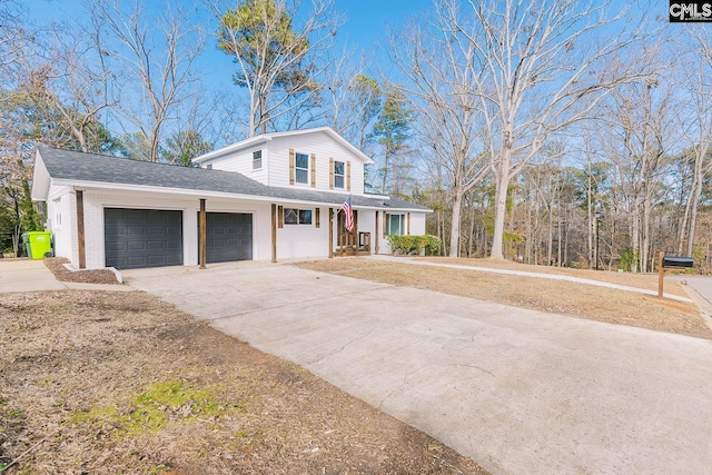 view of front facade featuring covered porch and a garage