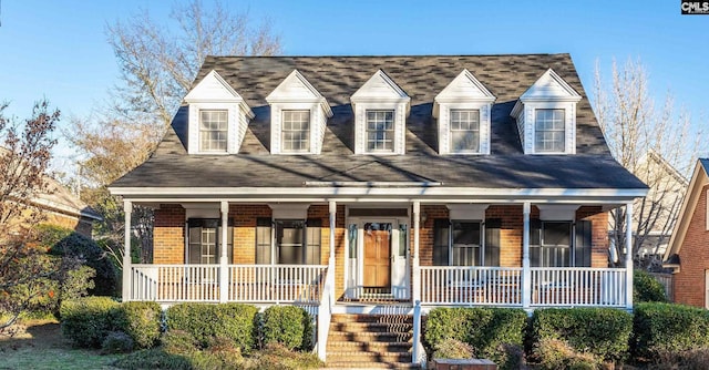 cape cod house with covered porch