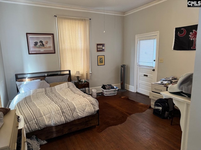 bedroom featuring wood-type flooring and ornamental molding