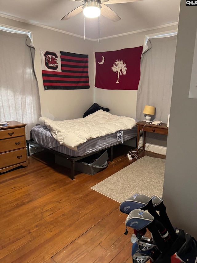 bedroom featuring ceiling fan and hardwood / wood-style flooring