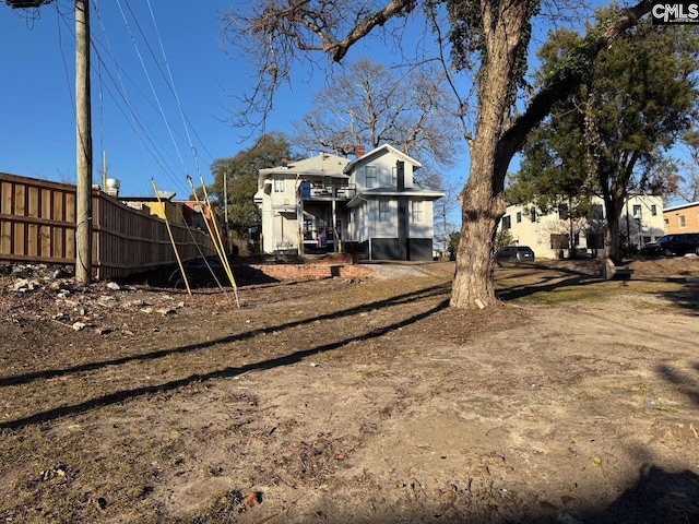 view of yard with a balcony