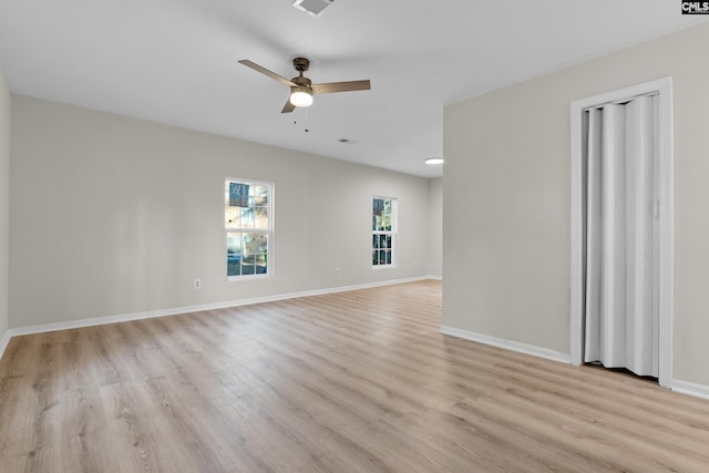 empty room featuring light hardwood / wood-style flooring and ceiling fan