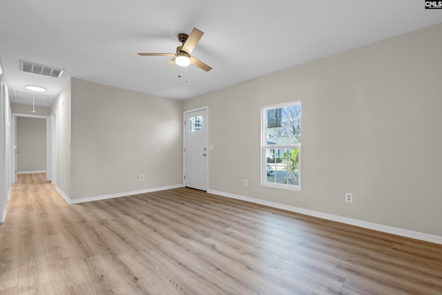 spare room featuring ceiling fan and light wood-type flooring