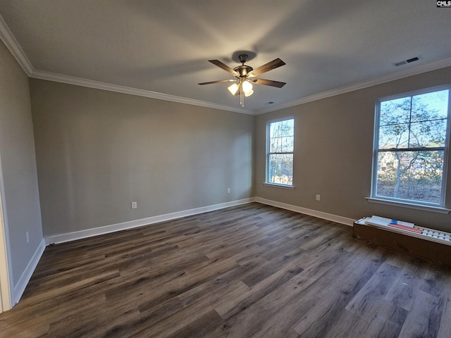 unfurnished room with ceiling fan, dark hardwood / wood-style flooring, and ornamental molding