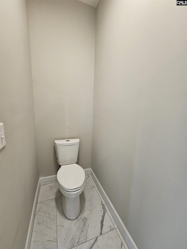 bathroom featuring toilet