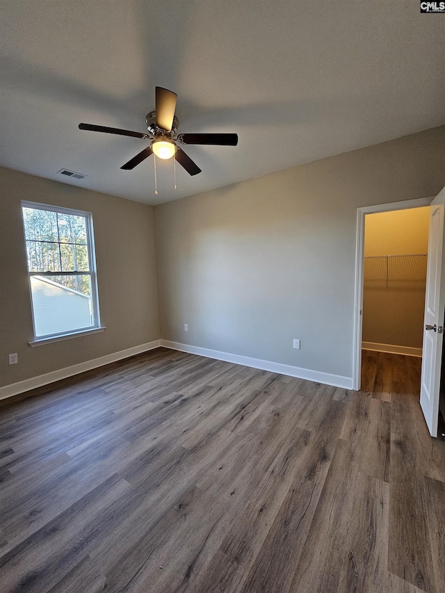 unfurnished room featuring ceiling fan and hardwood / wood-style floors