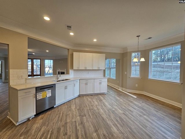 kitchen with white cabinets, dishwasher, kitchen peninsula, and sink