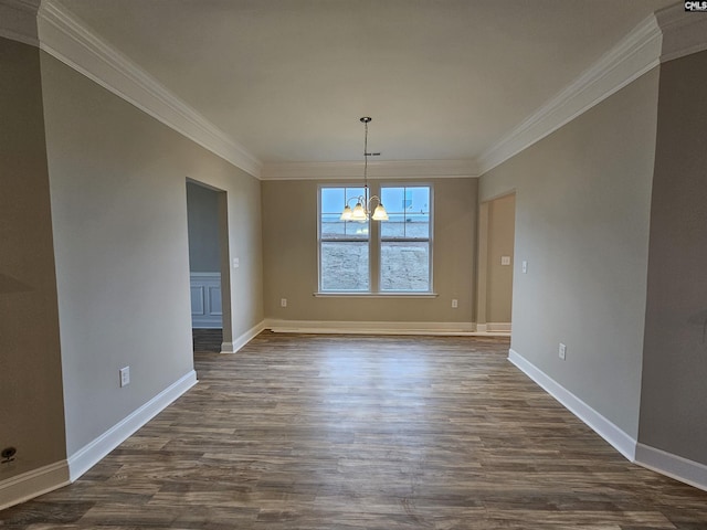 unfurnished dining area featuring dark wood-type flooring, an inviting chandelier, and crown molding