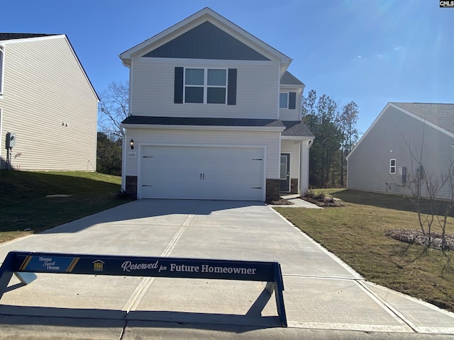 front of property featuring a front yard and a garage