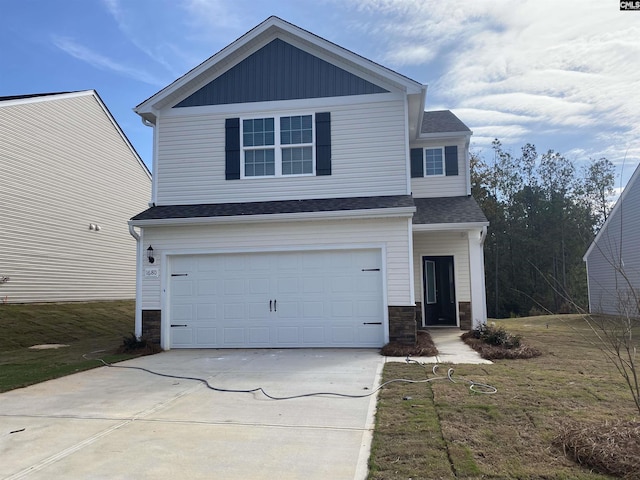 front facade with a front lawn and a garage