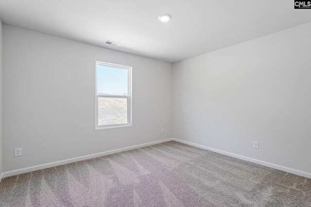 empty room featuring carpet flooring