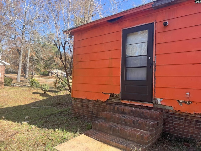 view of outbuilding with a yard