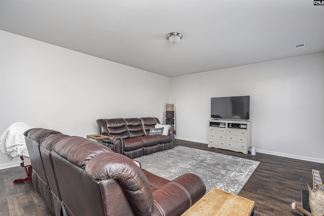 living room featuring dark wood-type flooring