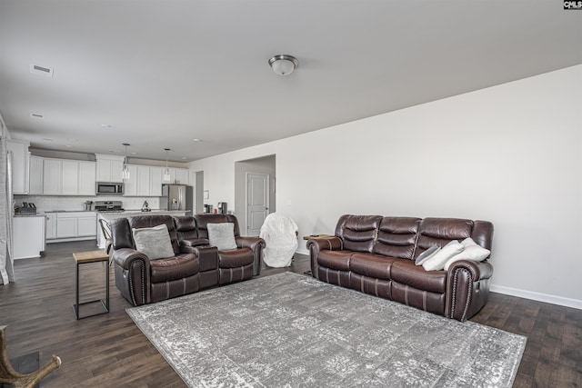 living room featuring dark hardwood / wood-style flooring