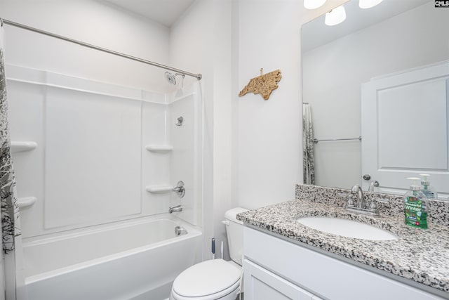 full bathroom with washtub / shower combination, vanity, and toilet