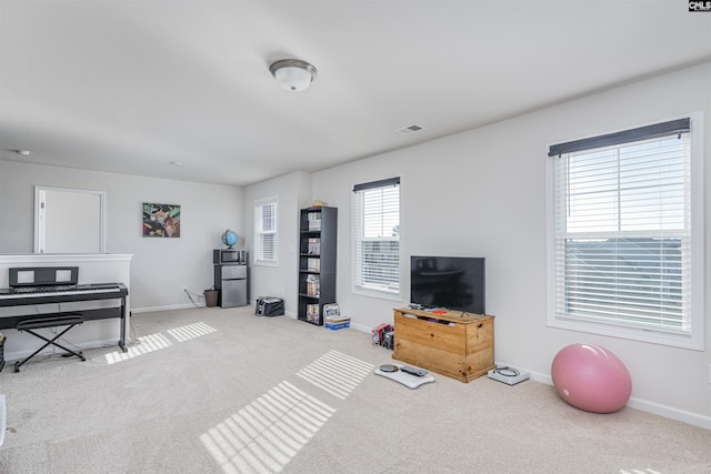 interior space featuring light colored carpet