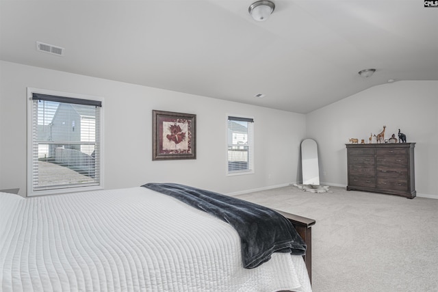 carpeted bedroom featuring vaulted ceiling