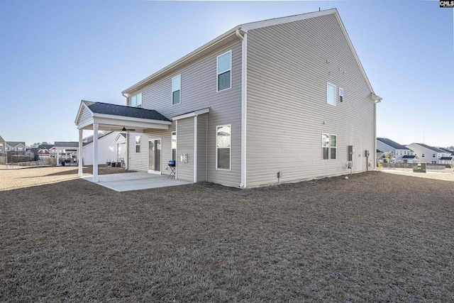 back of house featuring ceiling fan and a patio