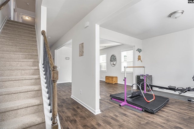 workout area with dark hardwood / wood-style floors