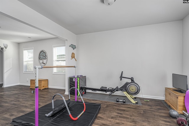 exercise area with dark wood-type flooring