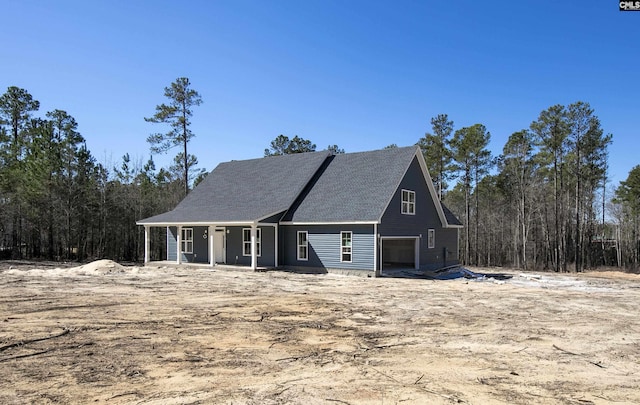 view of front of property with a porch and a garage