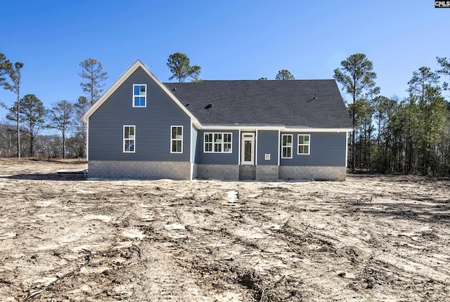 view of front of house with roof with shingles