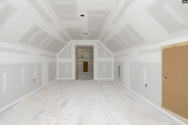 additional living space featuring lofted ceiling