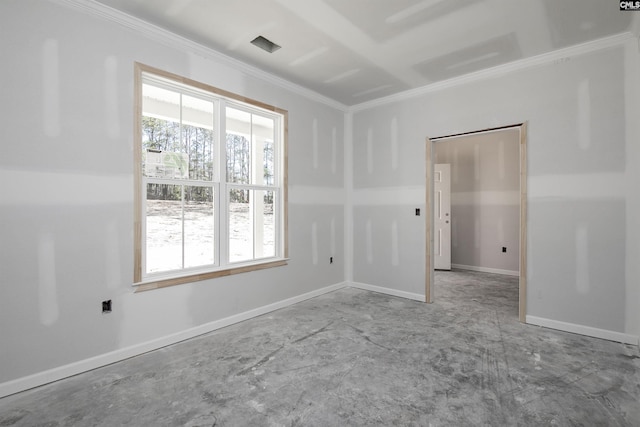 unfurnished room with ornamental molding and baseboards