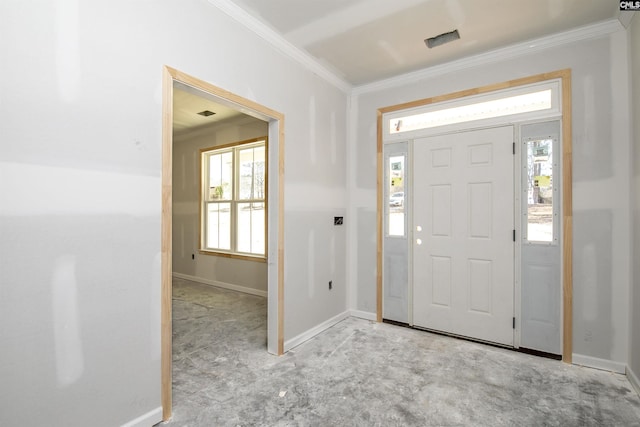 foyer entrance featuring baseboards, plenty of natural light, and crown molding