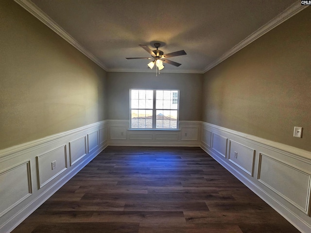 unfurnished room featuring ceiling fan, ornamental molding, and dark wood-type flooring